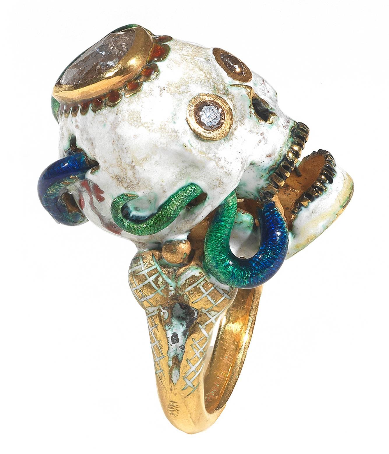 

The Renaissance style Memento Mori skull with a snake entering inside and a lizard ring made with champleve multicolored enamels, round cut diamonds eyes and pear cut diamond at the top.

Mounted in 18Kt yellow gold

Signed A. Codognato