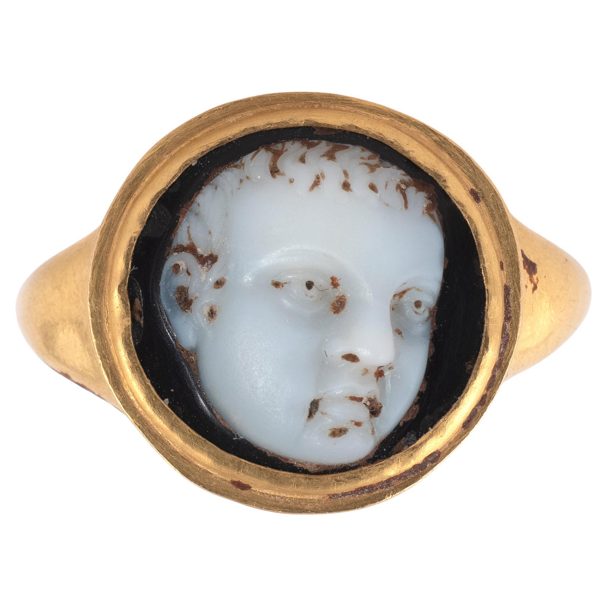 A Roman Gold Ring With A Three Quarters Portrait Of A Child 1st/2nd Century AD