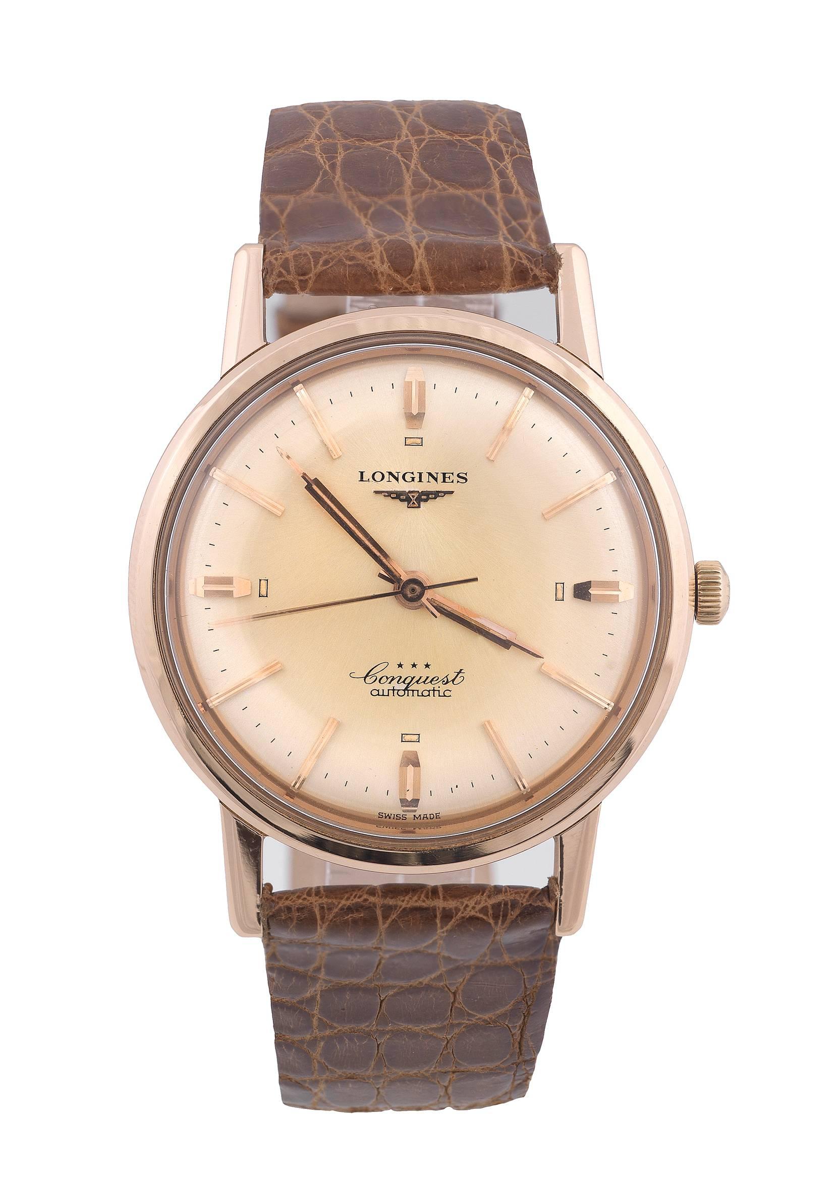 

Made in the 1960's. 

Fine, center seconds, water resistant, self-winding, 18K rose gold wristwatch with a gold plated Longines buckle. 
Case: 
three-body, polished, solid, lapidated lugs, inclined bezel, screwed down case back with embossed