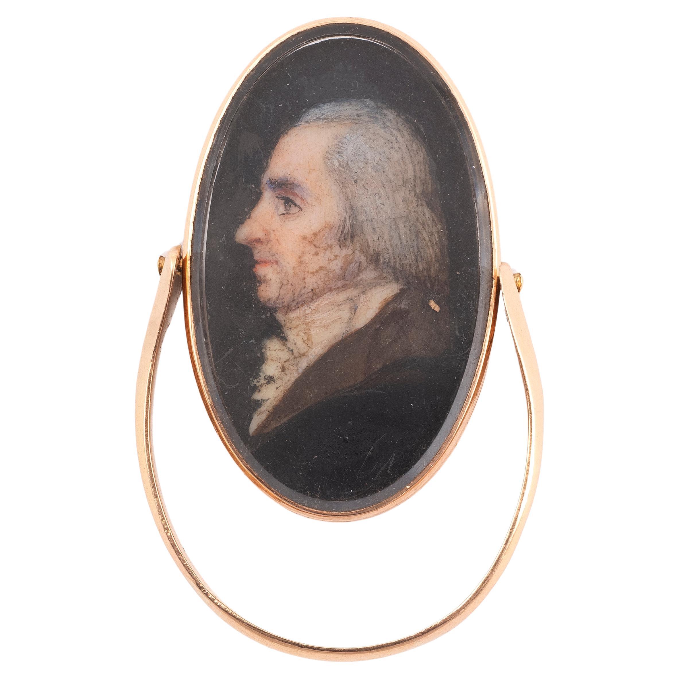 Rare sentimental oval-shaped, rotating, in pink 18kt gold decorated on one side with a painted miniature depicting a portrait of a man in profile under quartz crystal, on the other a flower motif with with rose-cut diamonds.
Rococo period
