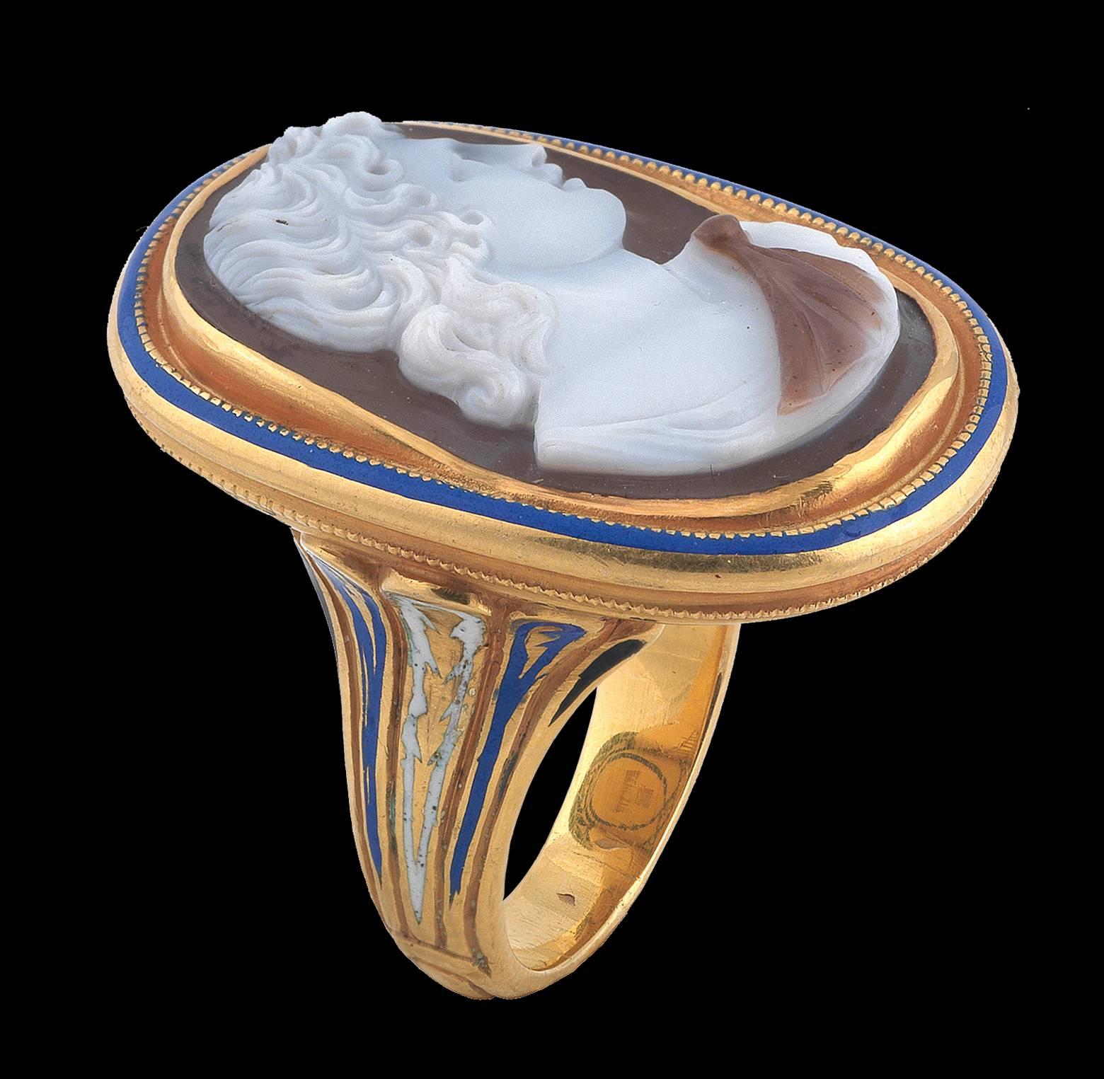 PLEASE NOTE: OUR PRICE IS FULLY INCLUSIVE OF SHIPPING, IMPORTATION TAXES & DUTIES.


The oval two color onyx cameo depicting the profile of Paris facing right.

Mounted in 18Kt gold and enamel renaissance revival setting signed A. Codognato