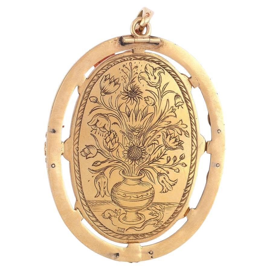The oval Mediterranean sea coral cameo depicting probably the Greek God Dionysus wearing a panther skin and bunch of grapes on the head. 

Mounted in gold and black enamel

The pendant 60 mm long, the cameo 45 mm high 31 mm wide 

