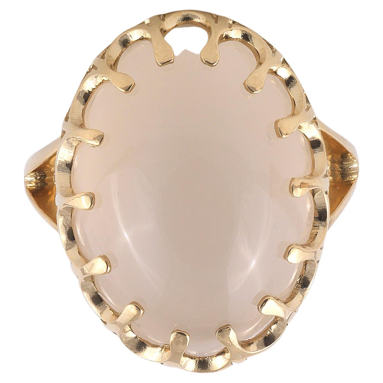 

The oval cabochon moonstone approximately 24mm 28mm collet mounted to a pierced gallery, finger size 7
Weight : 12,2gr.
