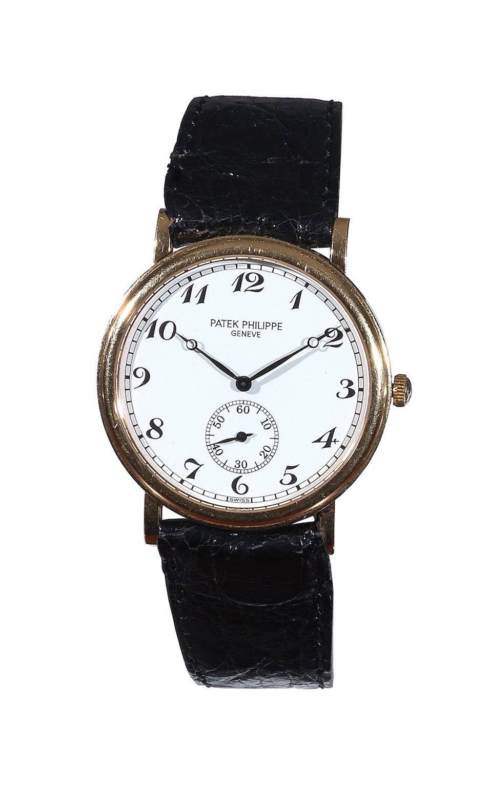 PLEASE NOTE: OUR PRICE IS FULLY INCLUSIVE OF SHIPPING, IMPORTATION TAXES & DUTIES.

Patek Philippe. A Yellow Gold Wristwatch with Breguet numerals.
Signed Patek Philippe, Geneve, ref. 5022, manufactured in 1999
Cal. 215 mechanical movement, 18