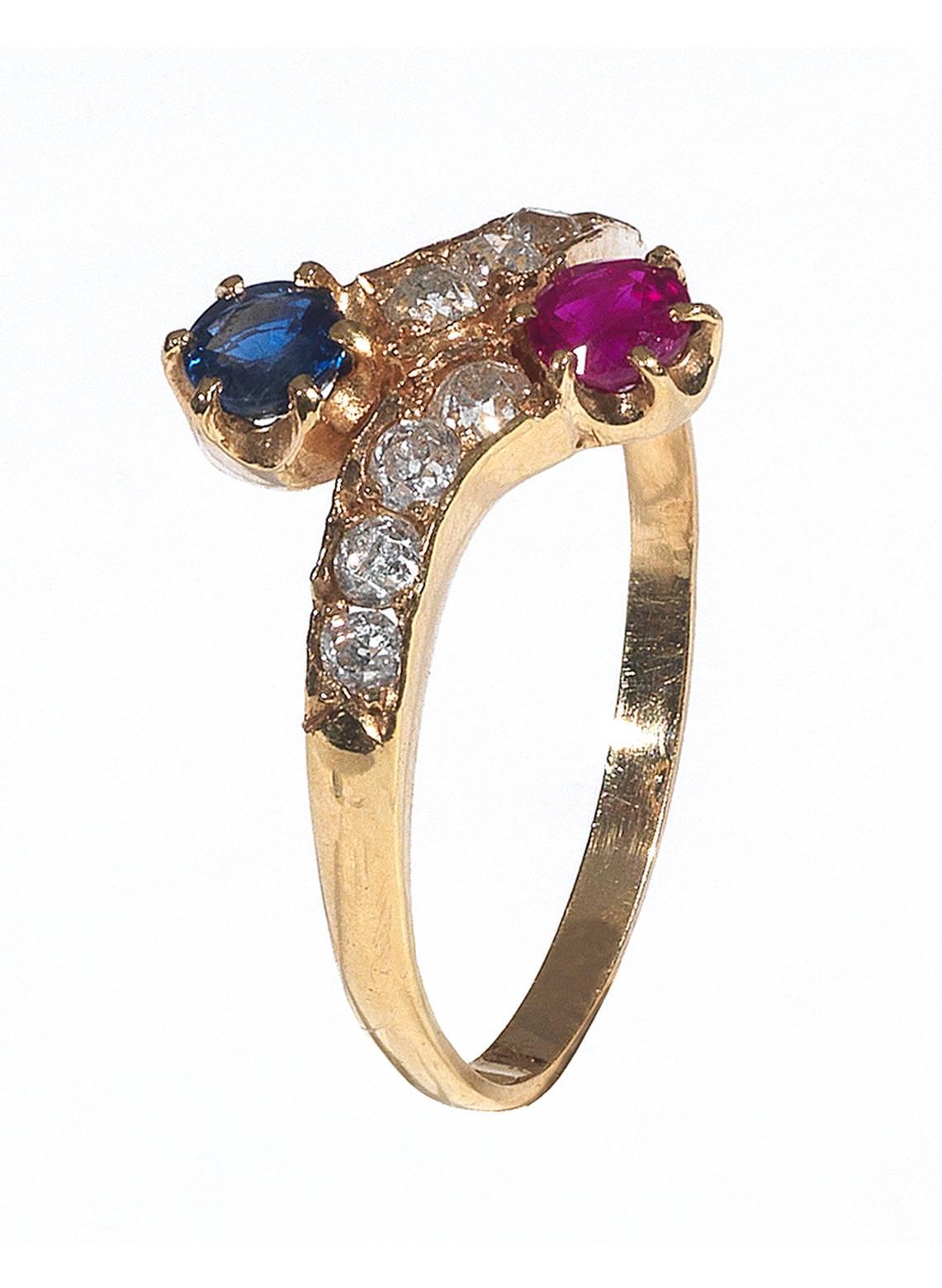 
The claw set round cut sapphire and ruby to the old cut diamond set half hoop.

Mounted in 15Kt yellow gold

Weight: 1.7 gr

Finger size: 7