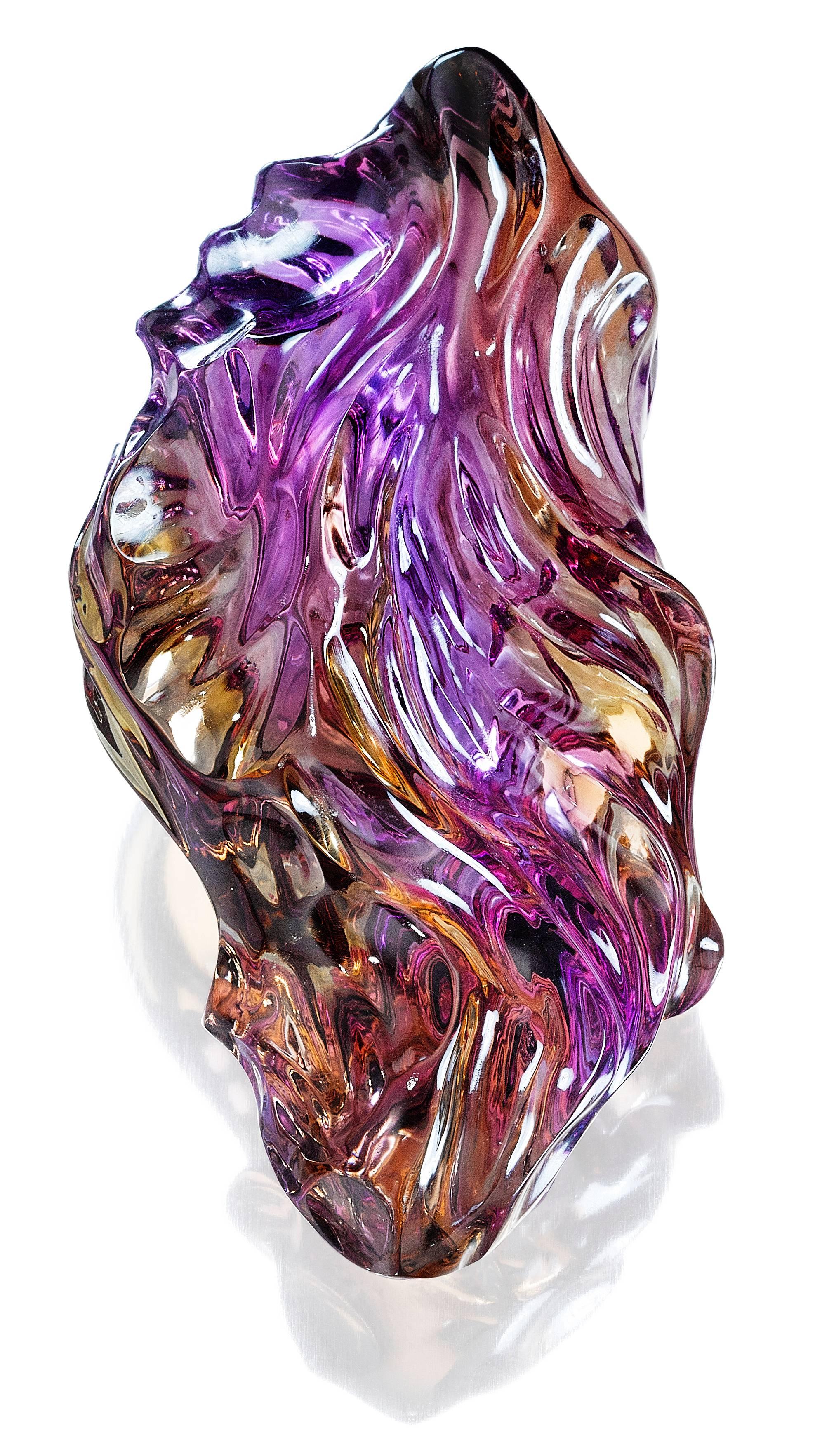 An exciting natural mixture of gold and purple make this carved ametrine a spectacular award-winning design. Recipient of a 1st place award in the prestigious AGTA competition. This carving is available either in a sterling silver pedestal or as a