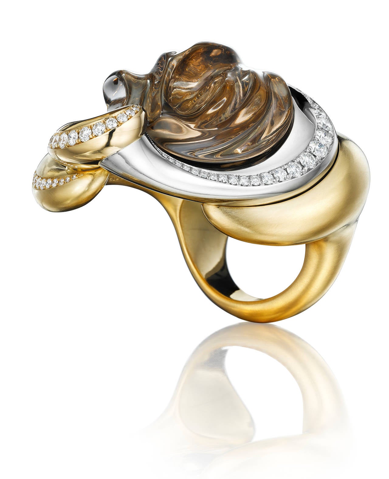 A genie, a sultan or an empress would wear this spectacular over-sized, seriously sensuous art ring. A truly magnificent piece of sculpture you can wear. This one-of-a-kind ring features a hand-carved 63.5 ct smoky quartz set in platinum, 18K yellow