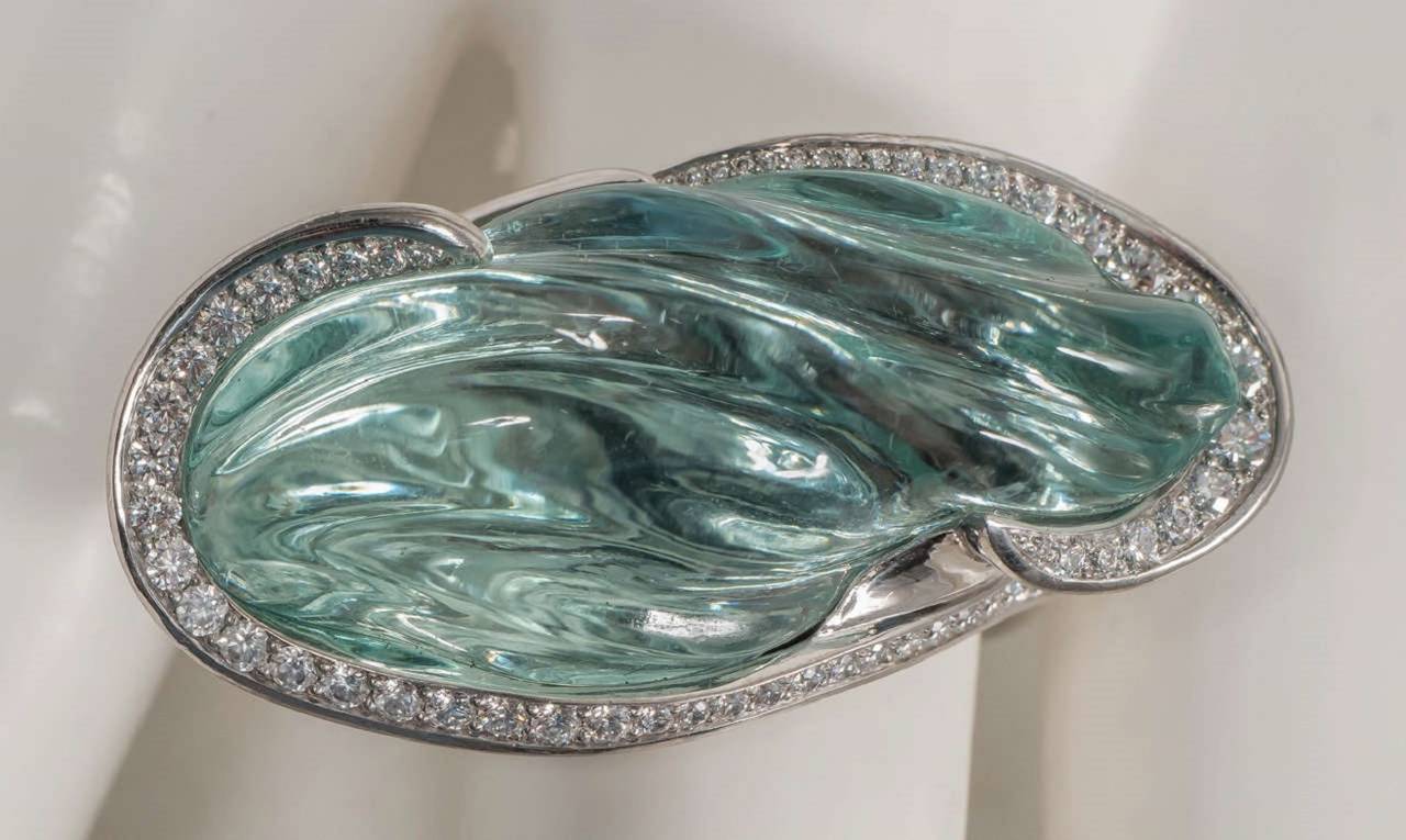 Naomi Sarna went to the mines in Madagascar to find this natural, unheated,  47 ct blue topaz, which she carved in a flowing, water-like design to remind her of the ocean around Madagascar. This Palladium ring won Palladium Honors from the