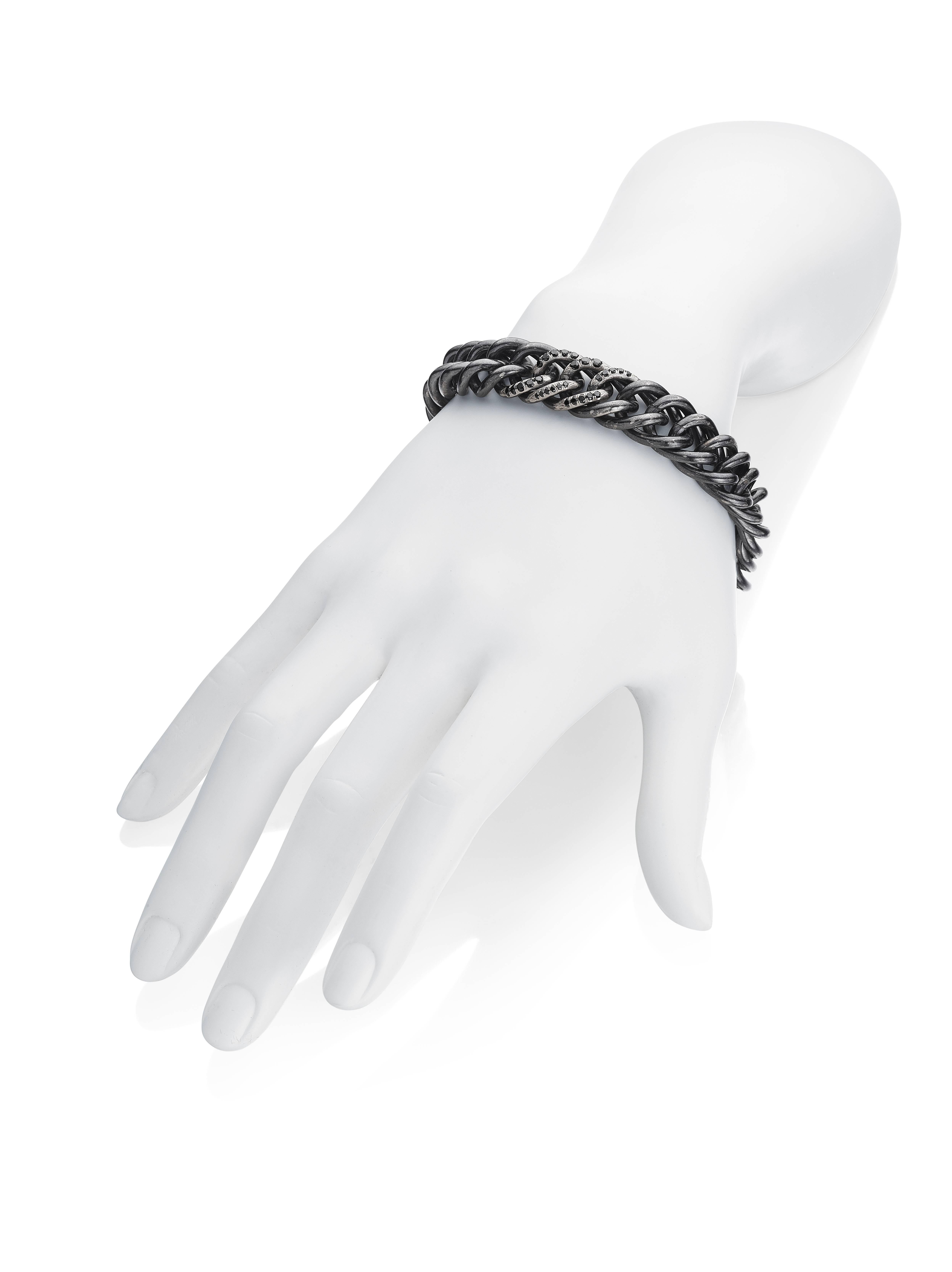 Handsome for anyone, this casual yet elegant bracelet is our nod of the head to trendy black diamonds and silver. This charming and stylish blackened sterling silver chain link bracelet is set with 0.715 carats of scintillating black diamonds adding