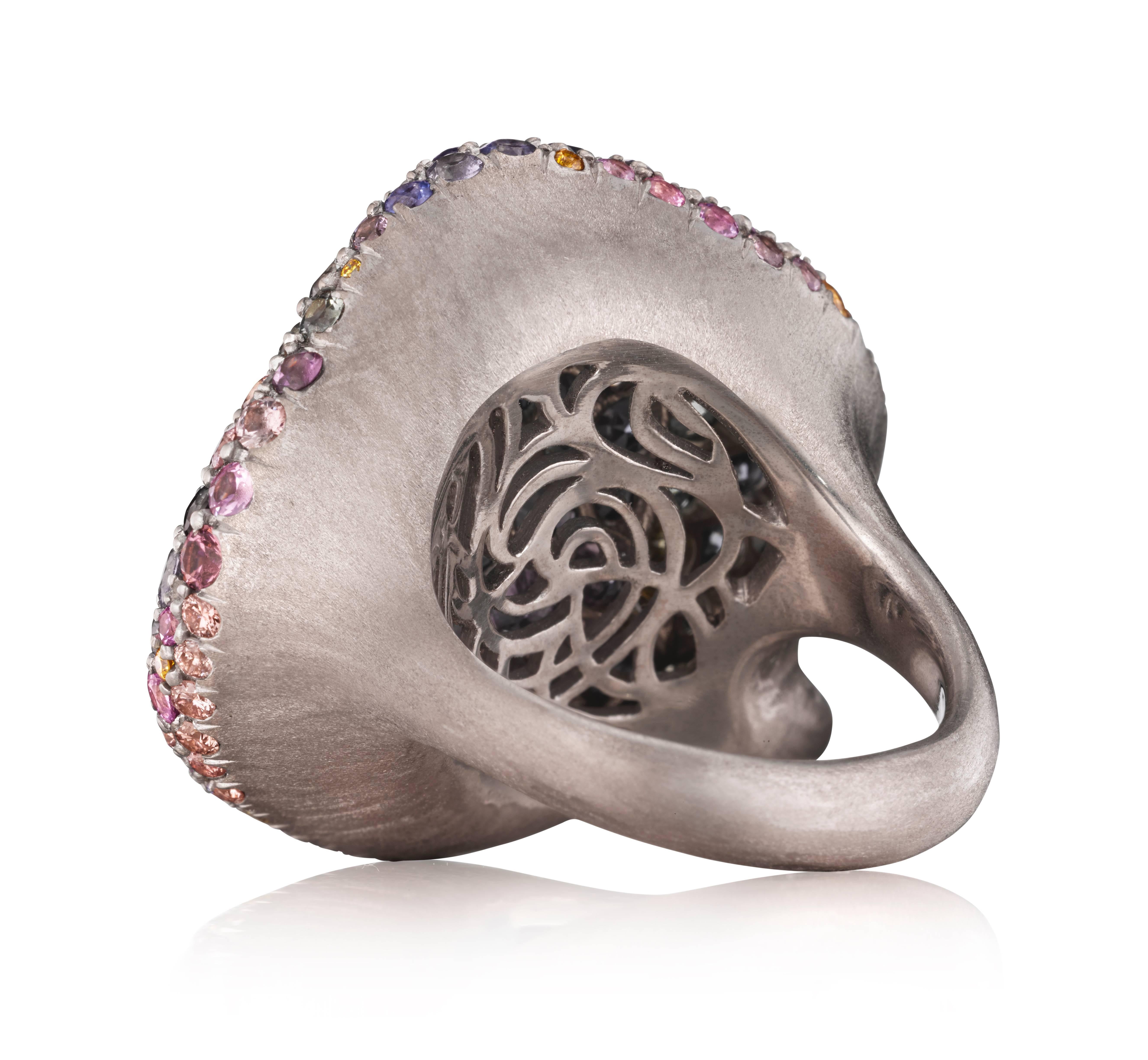 Ready to blossom on your hand, this vibrant, Spring Petal Ring was created with 18K natural white gold and set with 166 beautiful VS-FG diamonds and sapphires in a spectrum of colors. Like all rings created by Naomi Sarna, this piece is extremely