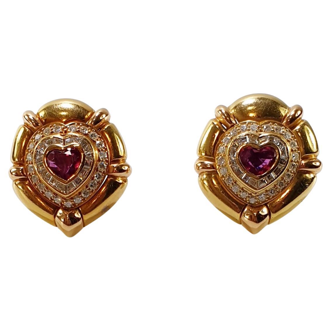 Pradera 18k gold Bulgary style Earrings with Diamonds and Burma Heart Ruby
Weight: 26,8 grams
Diamonds 42 round 0,10ct aprox 4cts of H/ VVS 
Dimonds 32 baguettes of 0,07  total aprox 2.24cts of H/VVS
Central Burma Heart Shape ruby of 2ct each