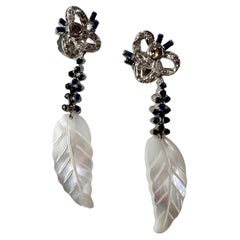 Long White Gold Earrings with Diamonds and Sapphires and Mother of Pearl Feather