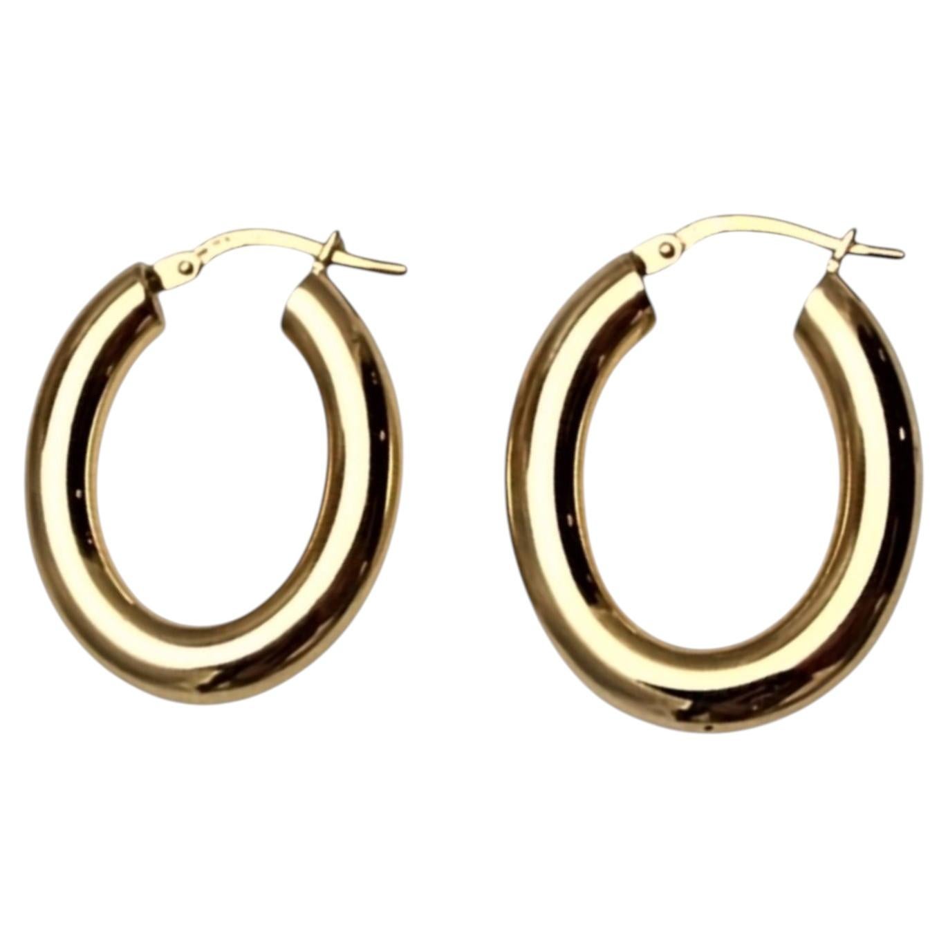 Pendientes de aro ovalados de oro amarillo de 14K n.º 25809 en venta