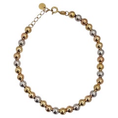 Bracciale con perline rotonde in oro giallo e bianco bicolore 18 carati n. 26144