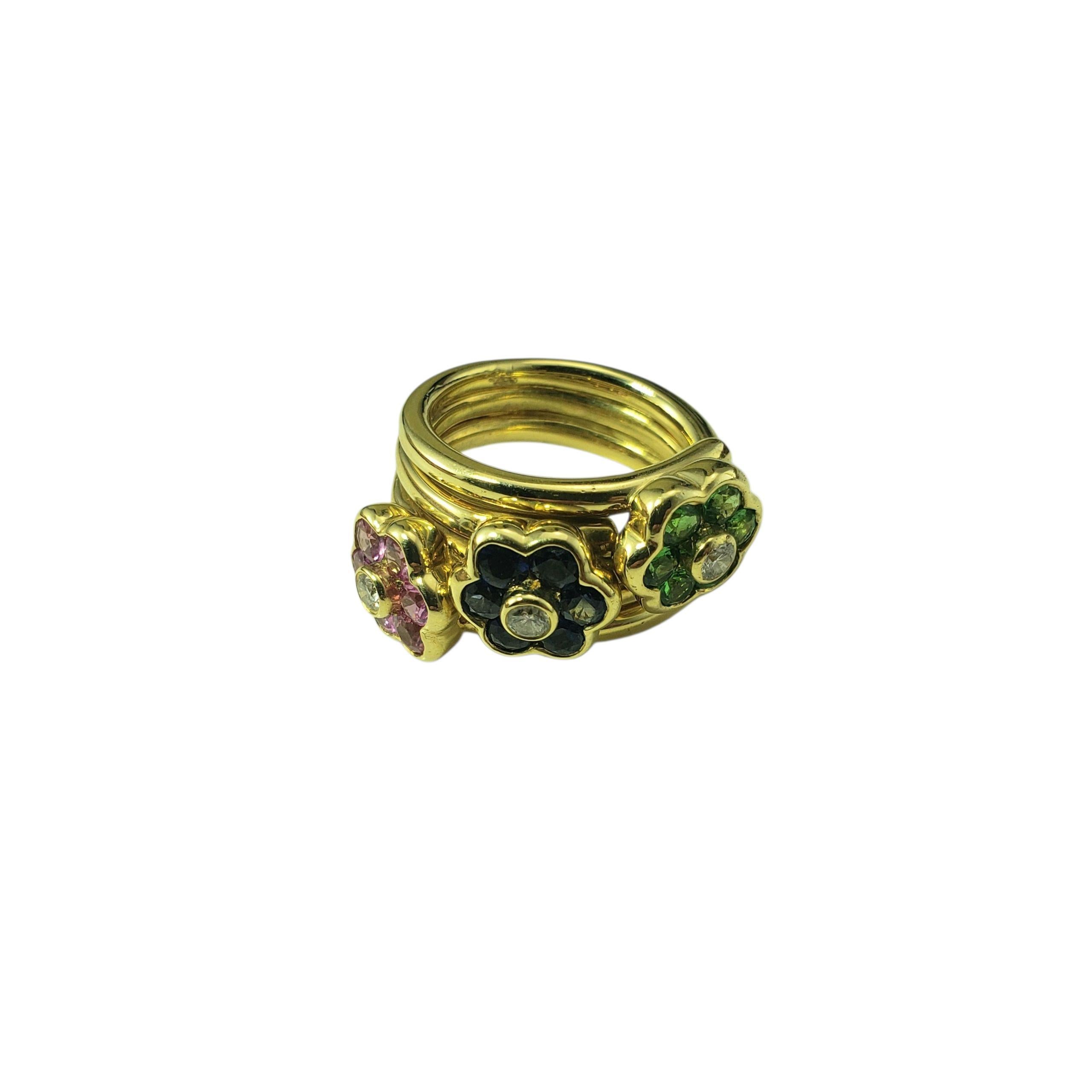 Bague en or jaune 14K et motif de fleur en pierres précieuses Taille 6 JAGi Certified-

Débordante de couleurs et de charme, cette bague fantaisiste en or jaune 14 carats est ornée d'un trio de fleurs en pierre précieuse en pleine éclosion. Serti de