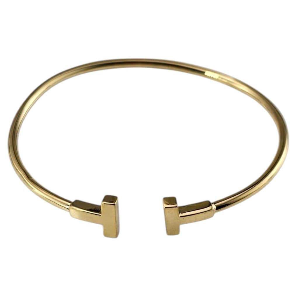 Pulsera de Tiffany & Co. con diseño de «T» en oro amarillo de 18 quilates, n.º 25893