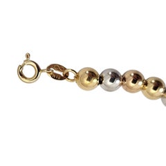 Bracciale con perline rotonde in oro giallo e bianco bicolore 18 carati n. 26144