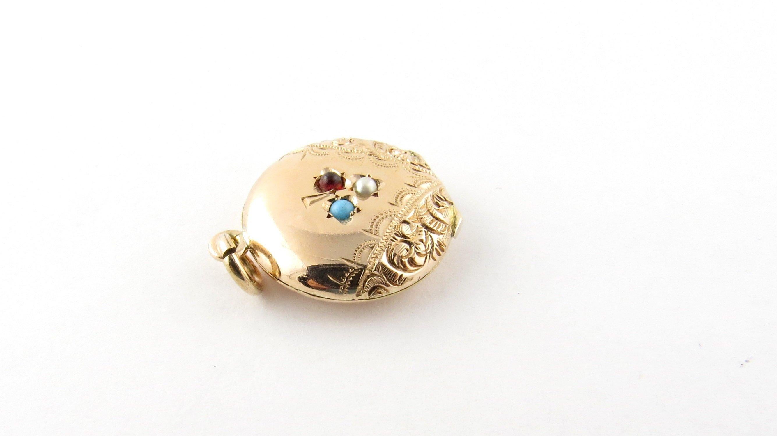 Vintage 10 Karat Yellow Gold and 3 Stone Locket Pendant. 
This stunning pendant features two 3D roses accented with colored stones framed in classic 14K yellow gold.
Size: 19 mm Weight: 2.8 dwt. / 4.4 gr.
 Acid tested for 10K gold.
Very good