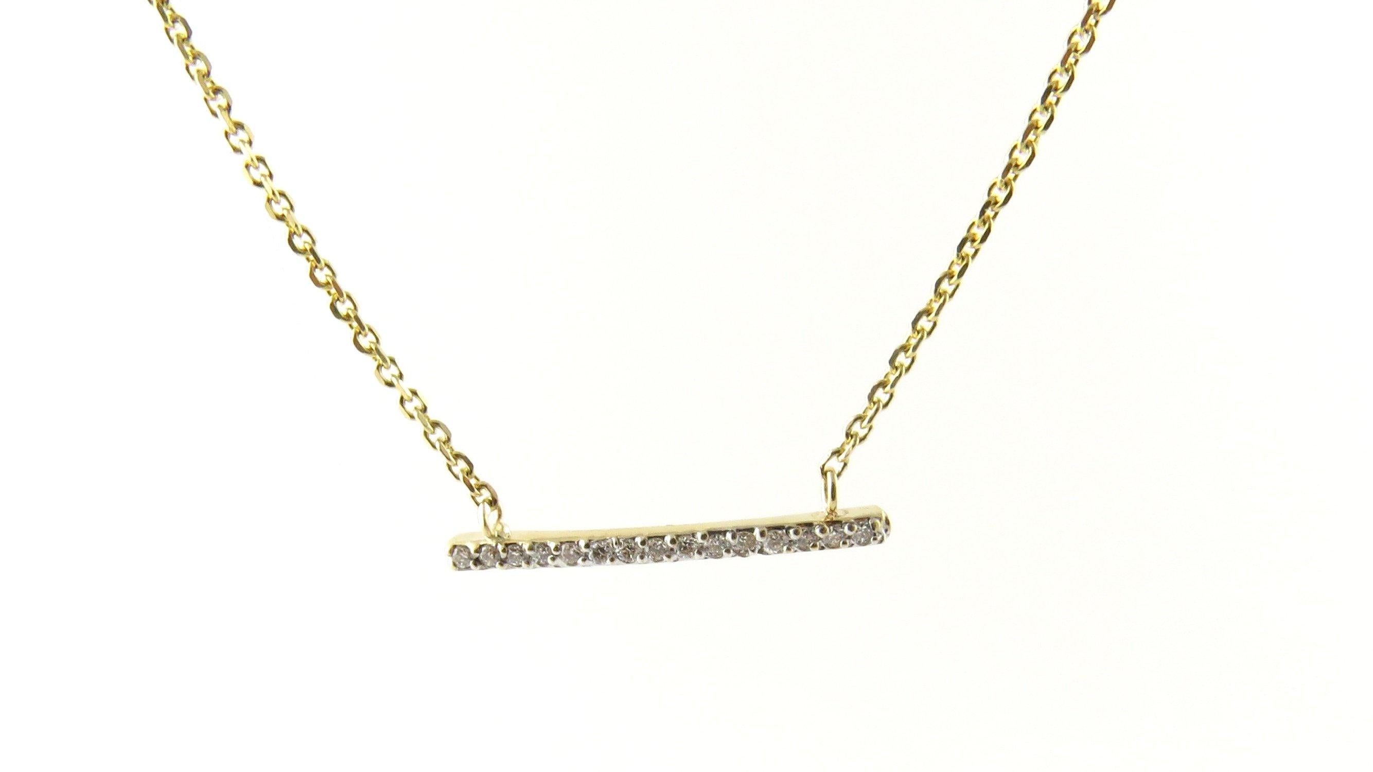Vintage 14 Karat Yellow Gold Diamond Bar Necklace. This sparkling necklace features a gracefully curved diamond bar (23 mm) adorned with round brilliant cut diamonds on a 16.5 inch yellow gold necklace.
Approximate total diamond weight: .15 ct.