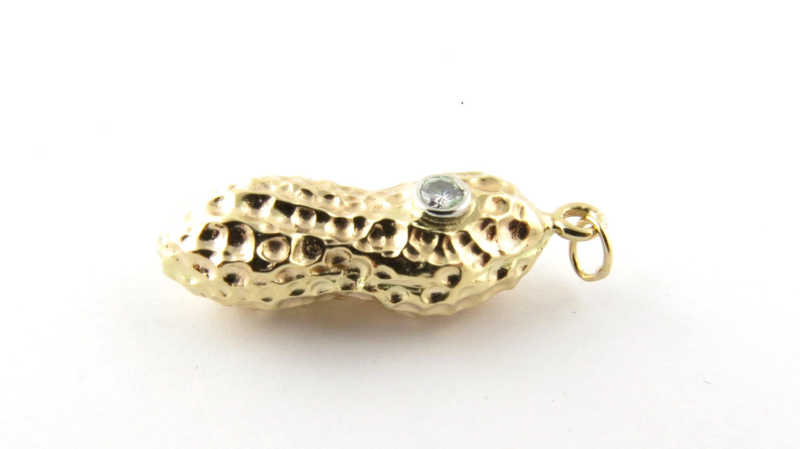 Vintage 14 Karat Yellow Gold and Diamond Peanut Pendant. The peanut represents good fortune and fertility! This lovely 3D charm features a beautifully detailed peanut accented with one round brilliant cut diamond.
Approximate total diamond weight: