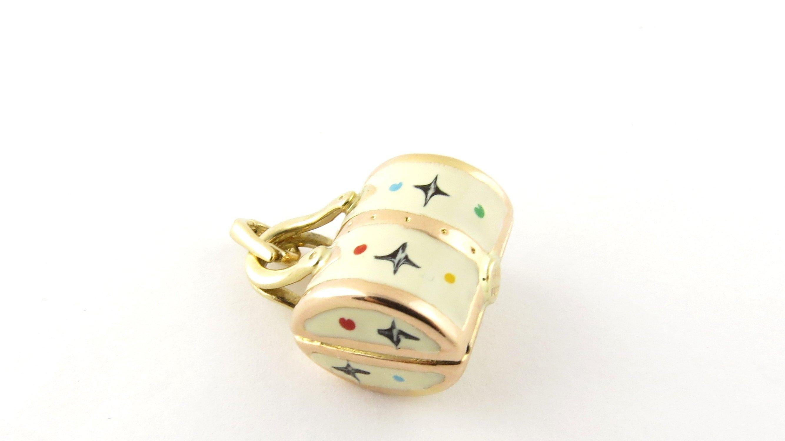 Vintage 14 Karat Yellow Gold Designer Handbag Charm. Perfect for the fashionista! This lovely 3D charm features a miniature designer handbag beautifully detailed in 14K yellow gold and enamel.
Size: 21 mm x 17 mm (actual charm) Weight: 2.1 dwt. /
