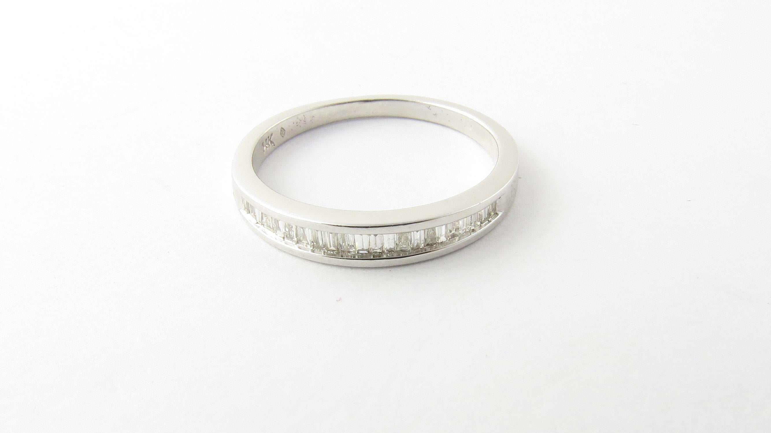 Vintage 14 Karat White Gold Baguette Diamond Wedding Band Size 6.5. This sparkling ring features 22 baguette diamonds set in classic 14K white gold. Shank measures 1.5 mm.
Approximate total diamond weight: .40 ct. Diamond color: H. Diamond clarity:
