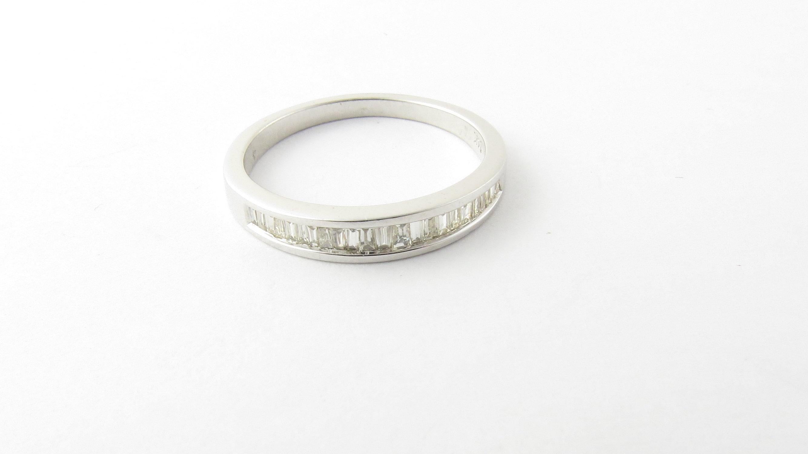 Vintage 14 Karat White Gold Baguette Diamond Wedding Band Ring Size: 6.25. This sparkling band features 22 baguette cut diamonds set in classic 14K white gold. Shank measures 2 mm. 
Approximate total diamond weight: .44 ct. Diamond color: H. Diamond