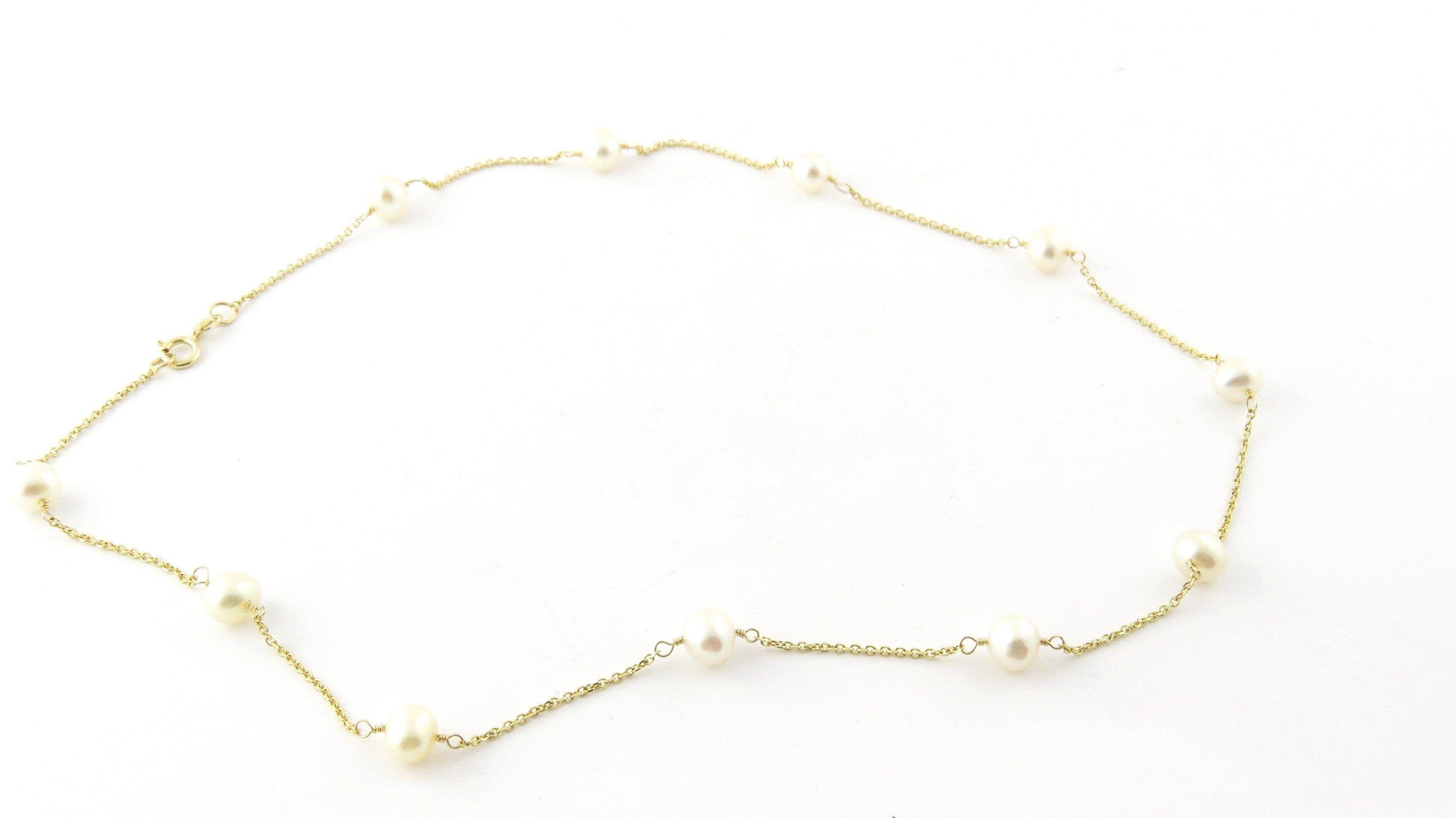 Vintage 14 Karat Yellow Gold and Pearl Necklace-This stunning necklace features 11 cultured pearls (5-6 mm each) set on a delicate 14K yellow gold necklace. Size: 16 inches Weight: 2.9 dwt. / 4.6 gr. Stamped: 14K Very good condition, professionally
