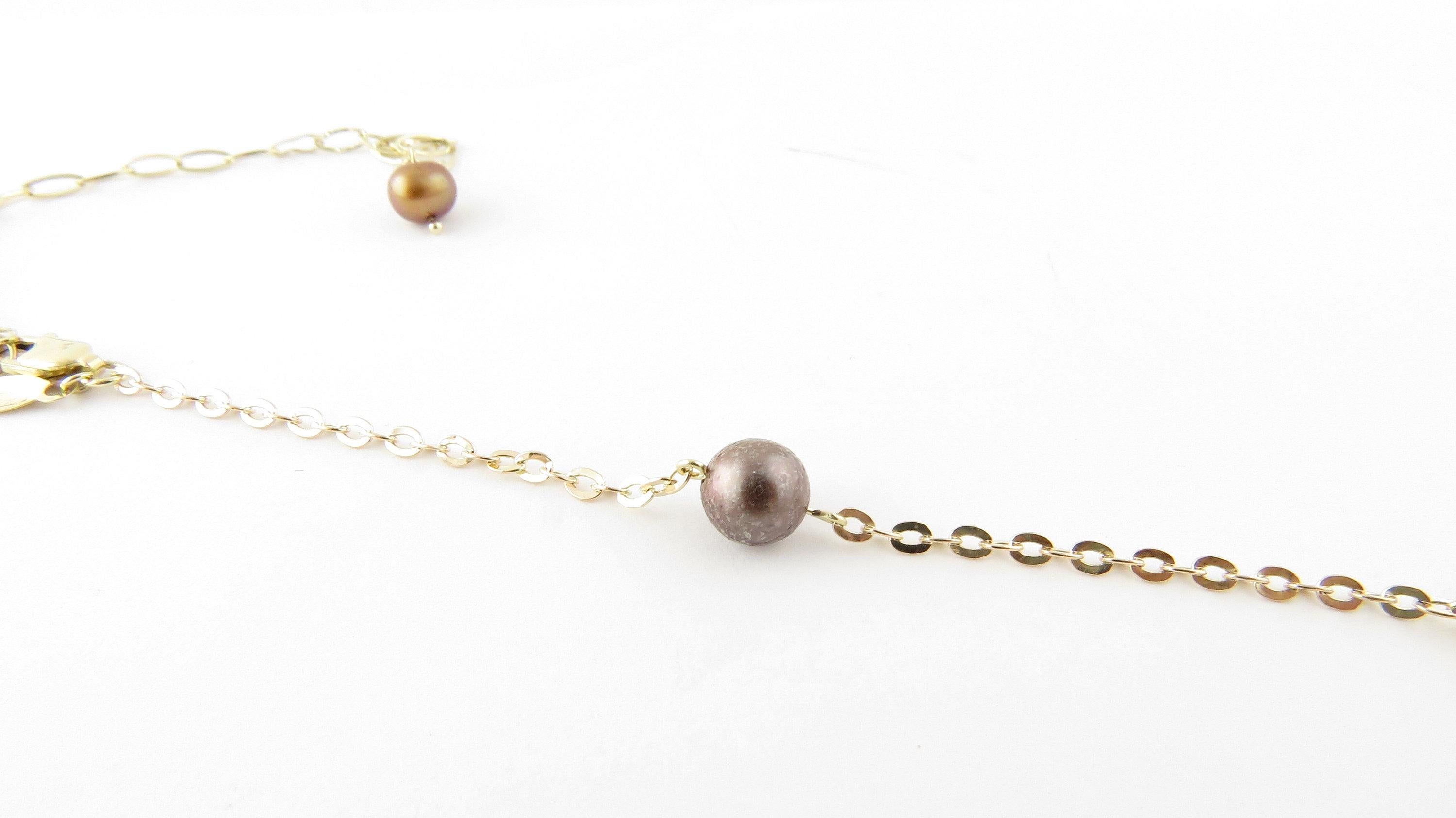 Vintage 14 Karat Yellow Gold Cultured Pearl and Citrine Necklace-

This lovely necklace features four briolette cut citrines quartzes, and 6 cultured dyed fresh water pearls measuring 6-7mm   Set on a classic 14K yellow gold chain.

Citrines total