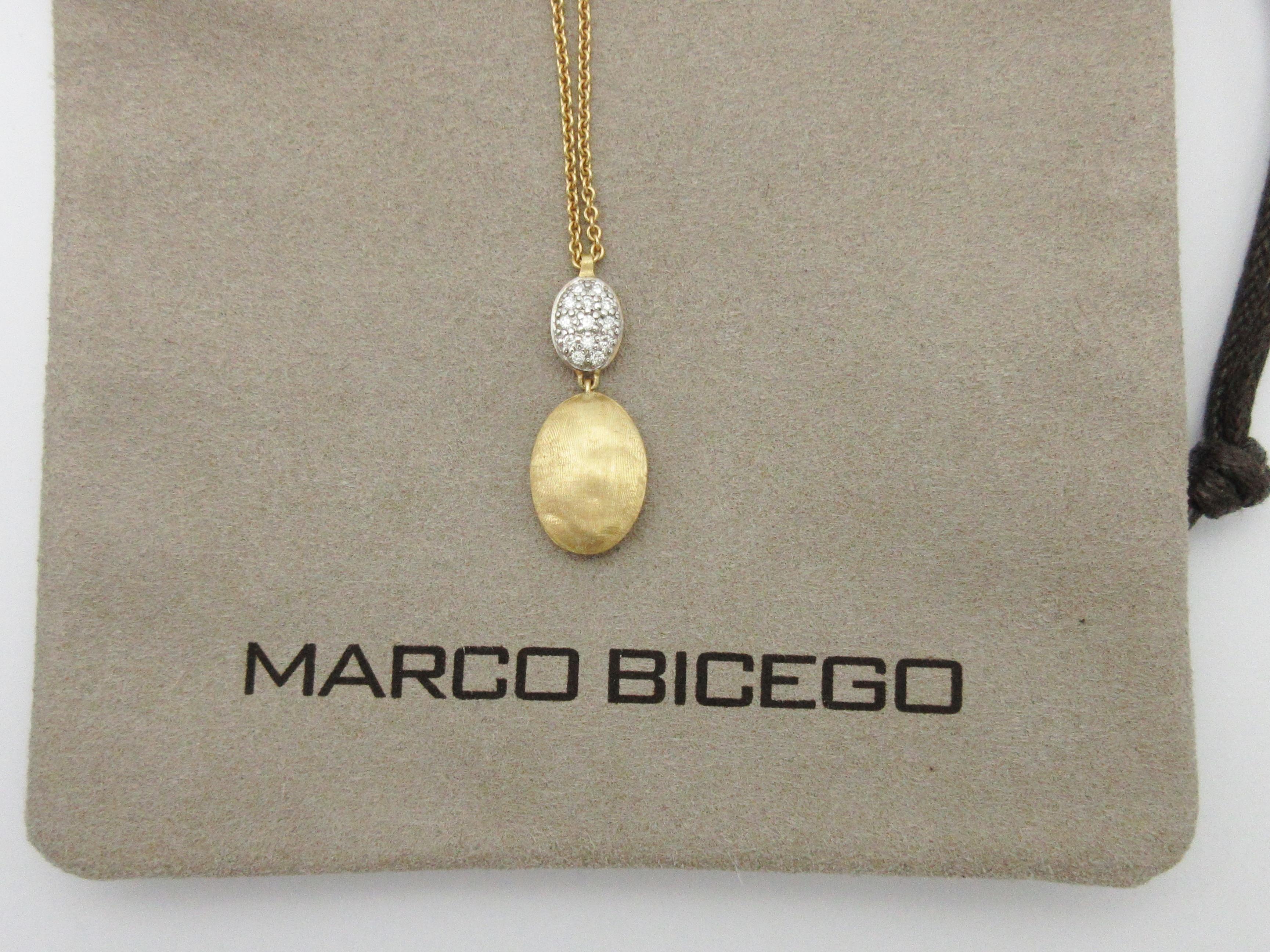 This beautiful necklace by designer Marco Bicego is from his Siviglia collection and features two pebble drops, one with diamonds set in white gold.  The total diamond weight is approximately .10cttw, and the necklace is adjustable in length from