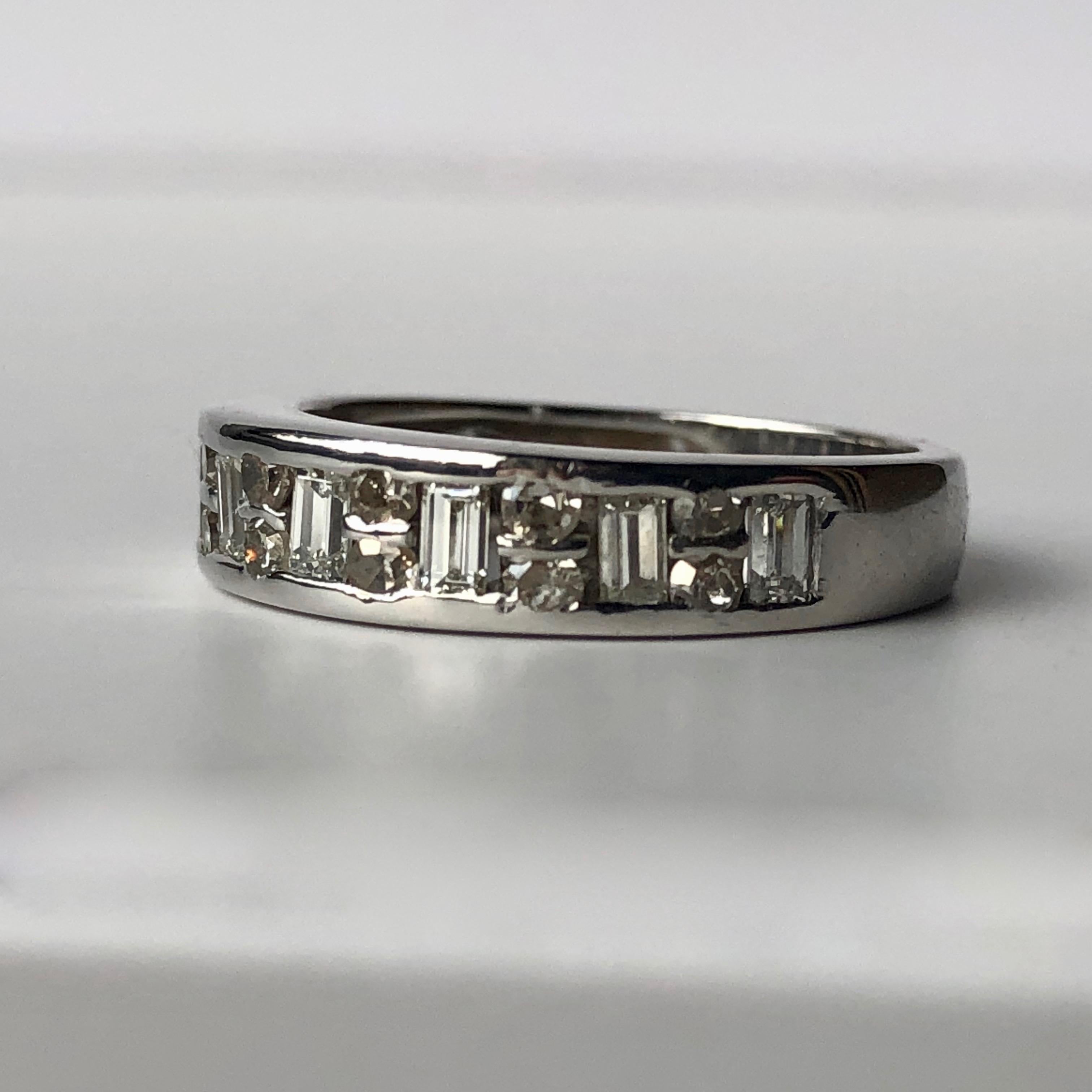 An 18k White Gold Eternity Wedding Band

Set With An Estimated .90ct Of White Diamonds

Round Brilliant Cut Interspaced With Baguette Cut Diamonds


We Are Happy To Offer A free Sizing Service With This Piece - The Ring Is Currently A UK Size K