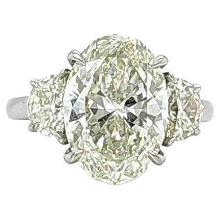 Louis Newman & Co 4.50 Carat Oval Diamond GIA Certified Three Stone Ring For Sale