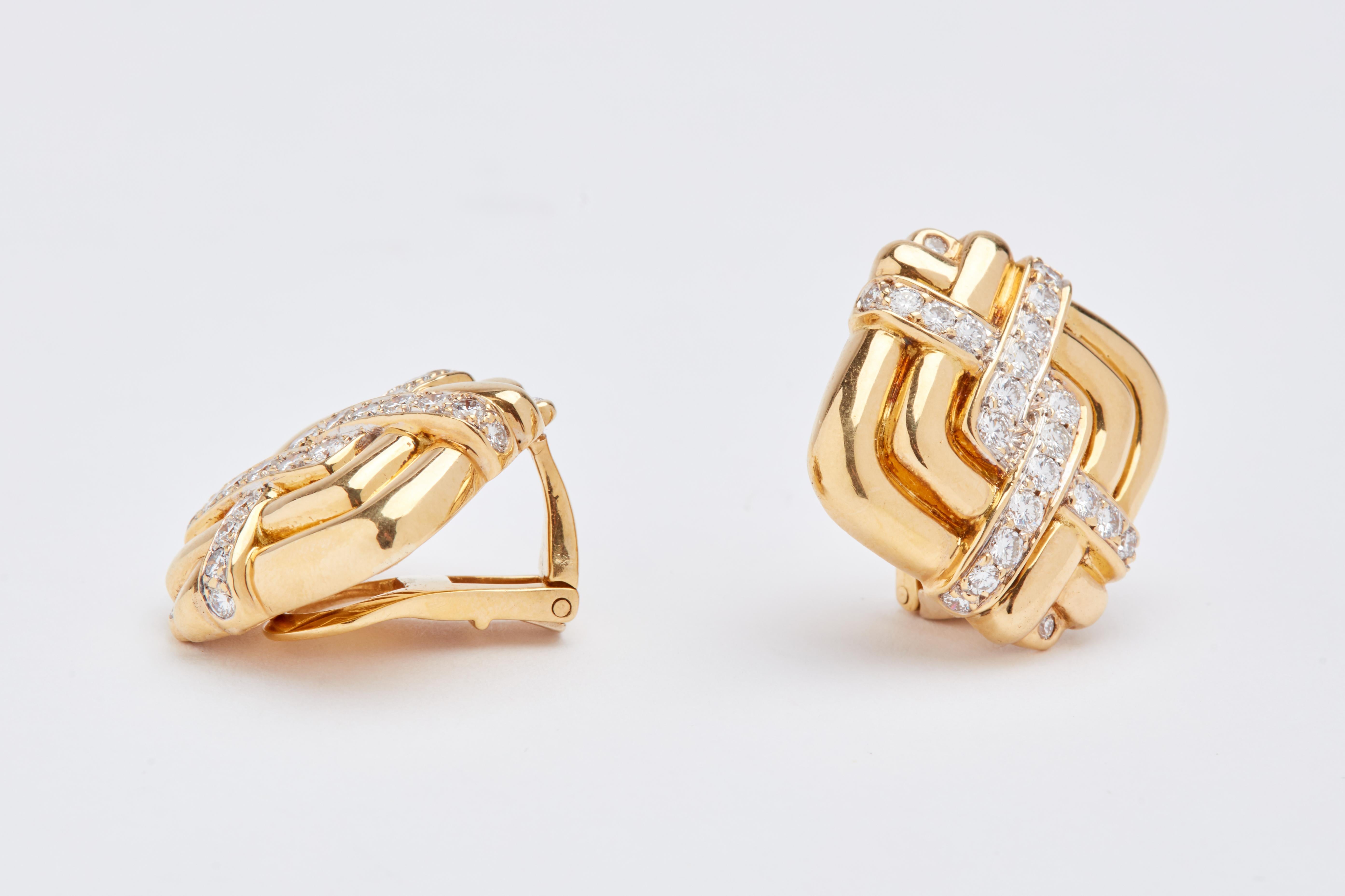 18k yellow gold and diamond ear clips. aprox 2 carats total of round white diamonds. 1 inch sqare. 