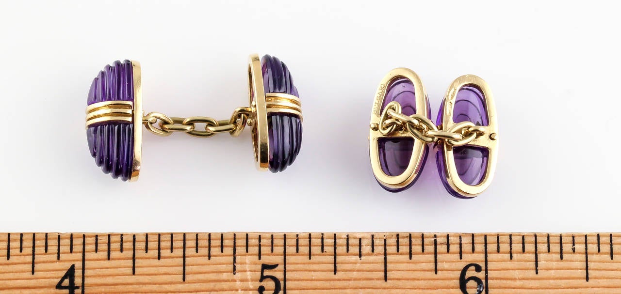 Rare and unusual carved amethyst and 18K yellow gold cufflinks by Bulgari, circa 1960s.
Hallmarks: Bulgari, 750, Italian standard mark.