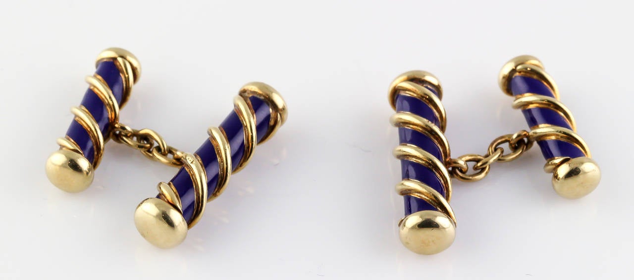 Elegant blue enamel and 18K yellow gold bar cufflinks by Tiffany & Co. Schlumberger. 

Hallmarks: Tiffany, 18K, Schlumberger.