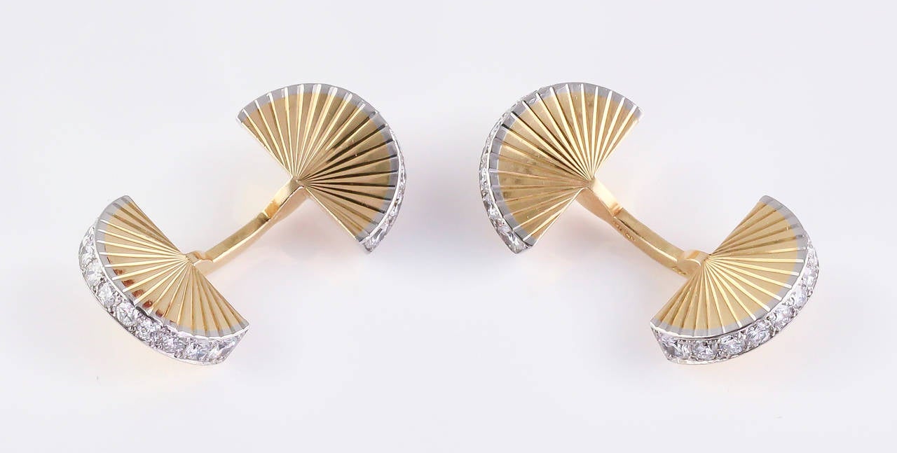 Rare and unusual platinum, 18K yellow gold and diamond fan cufflinks by Cartier, circa 1950s. They feature high grade round brilliant cut diamonds, approx 1 carat.  Cufflinks include Cartier box of similar age.

Hallmarks: Cartier Paris, reference