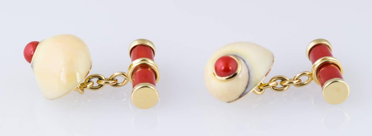 Whimsical coral and 18K yellow gold seashell cufflinks by Trianon. Original retail was $3800.

Hallmarks: Trianon maker's mark, 750, reference numbers, copyright.