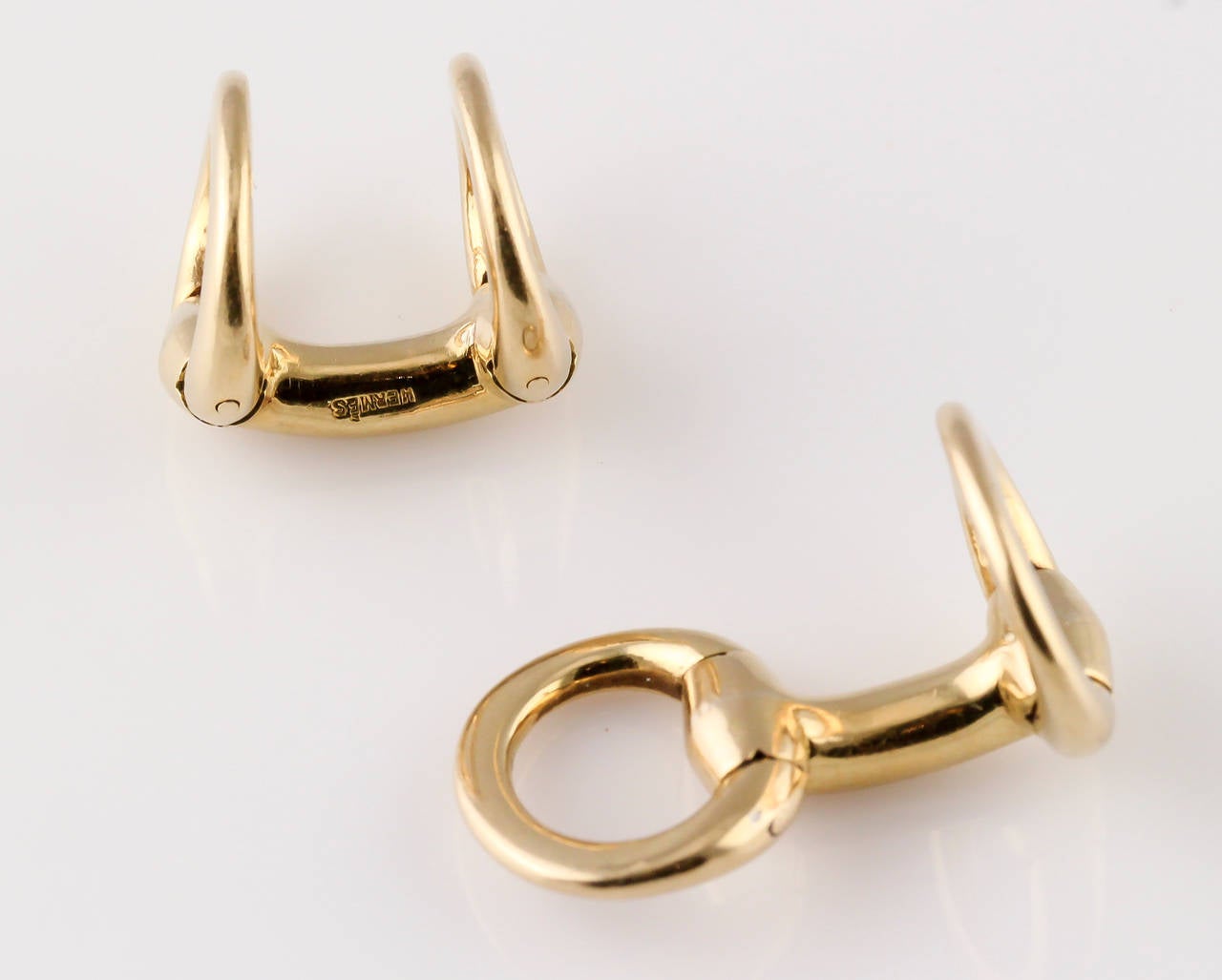 Handsome 18K yellow gold cufflinks by Hermes, in the shape of horse bits.
Hallmarks: Hermes, maker's mark, French 18K gold assay marks.