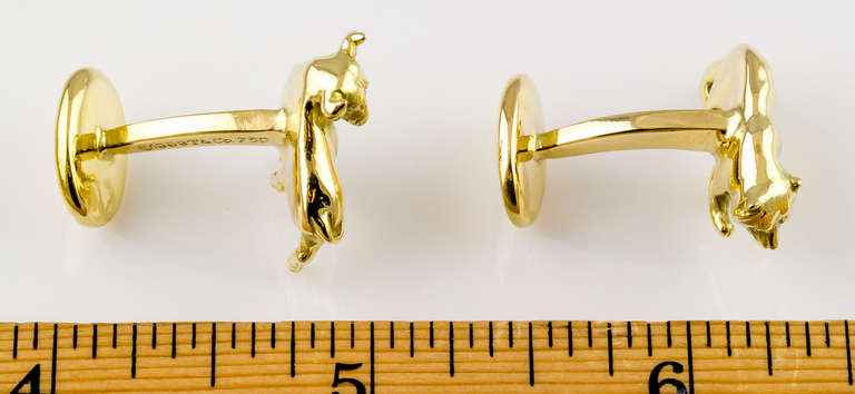 Clever and handsome pair of 18K yellow gold stock market inspired cufflinks by Tiffany & Co. They resemble a bull and a bear.
Hallmarks: T. & Co., 1999, 750, copyright.