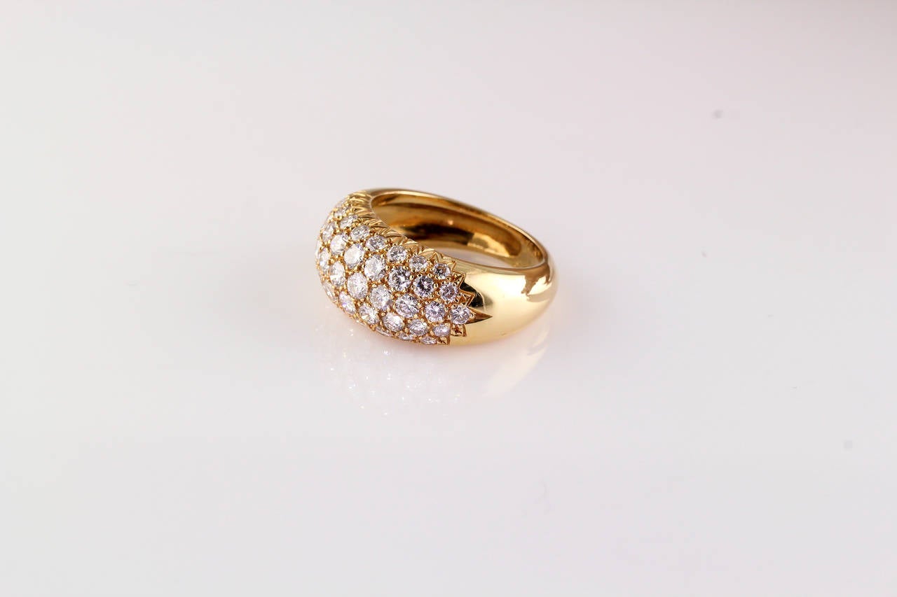 Exceptional diamond and 18K yellow gold ring of French origin. It features high grade pave set diamonds, approx. 1.8cts total weight. Size 6.25

Hallmarks: 18K, reference numbers, French 18K gold assay mark, B 1,80.