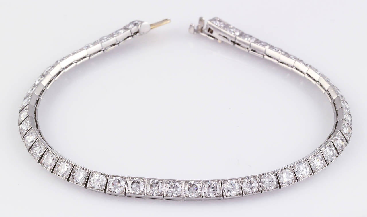 Timeless diamond and platinum tennis bracelet by Tiffany & Co, circa 1920s-30s.. This exquisite piece features very high grade round brilliant cut diamonds, approx 7.0cts total weight. Approx. 7