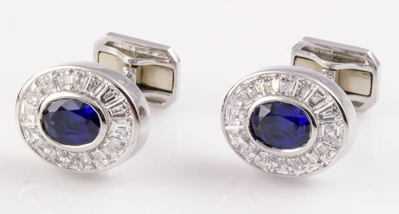 Impressive blue sapphire, diamond and platinum cufflink stud set by Harry Winston. They feature rich blue oval shaped sapphires, approx. 5.0cts total weight, with very high grade diamond cut diamonds, approx. 11.0cts total weight.  Set features four