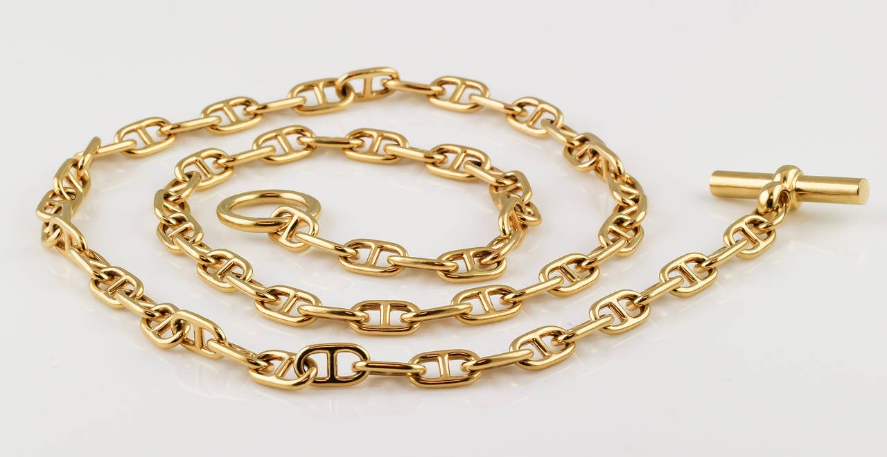 Elegant 18K yellow gold toggle link necklace from the Chaine D'Ancre collection by Hermes. Approx 28.5 inches long. 
Hallmarks: Hermes Paris, maker's mark and French gold assay marks.