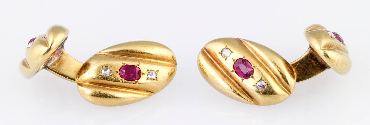 Rare and unusual set of ruby, diamond and 14K gold cufflinks of Russian origin, circa 19th century, and made by Egor Cheryatov for the Lorie firm. They feature rich red rubies in the center, and two high quality diamonds on each side. 
F. A Lorie