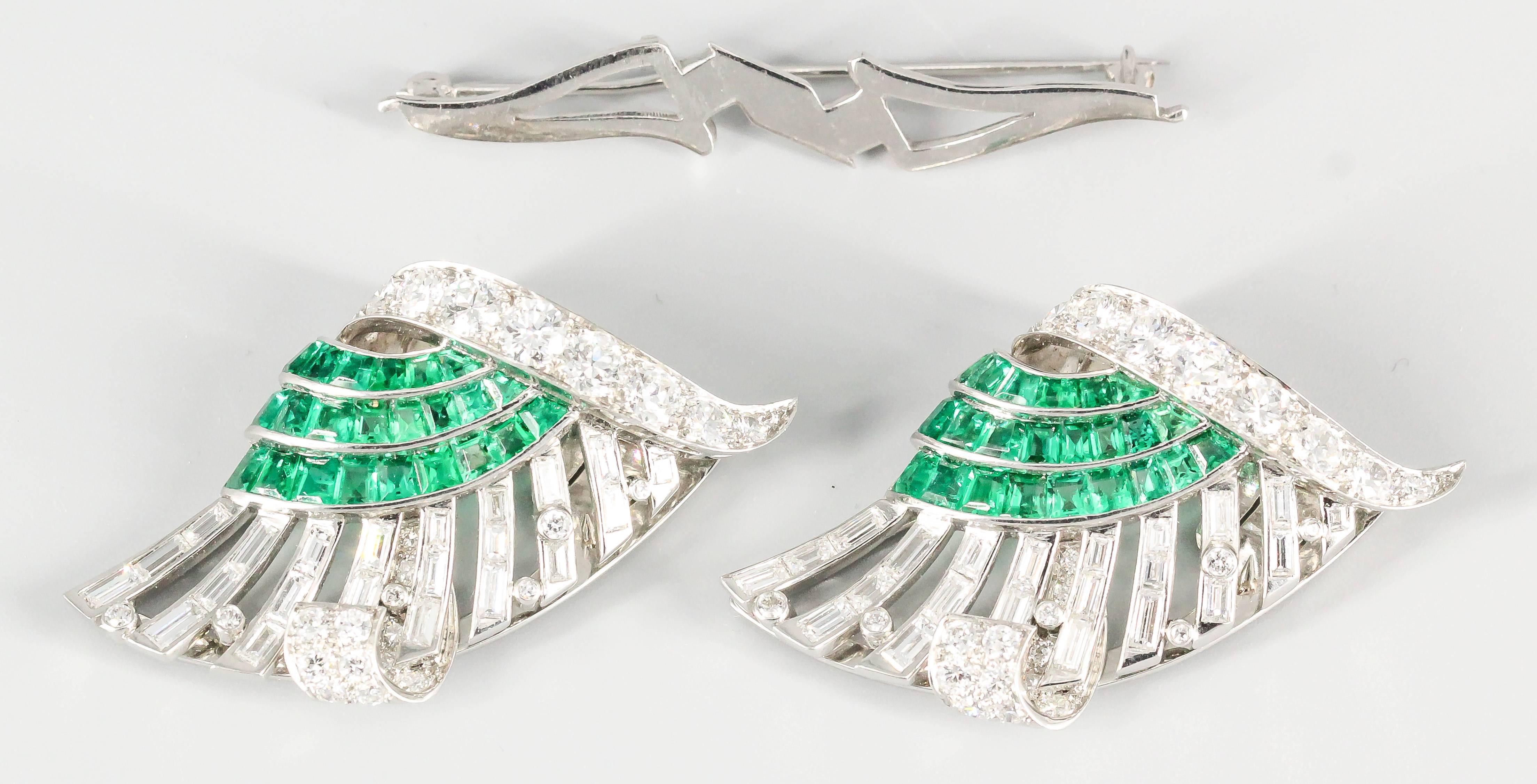 Exceptional emerald, diamond and platinum double clip brooch by Tiffany & Co., circa 1930s. It features very vibrant calibre cut emeralds, along with round brilliant cut and baguette cut diamonds of high grade. This beautiful piece can be worn as a