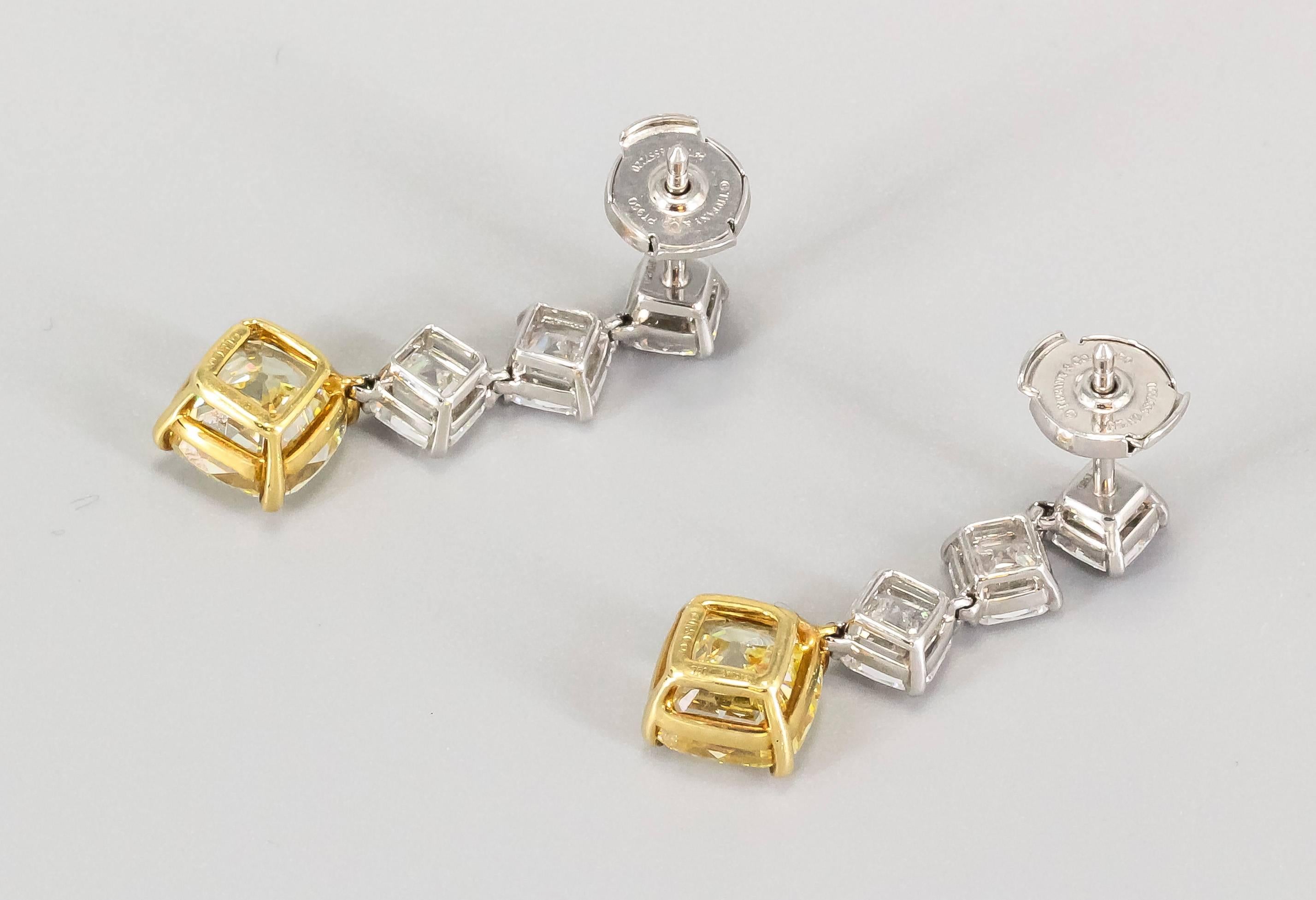 Important white and fancy intense yellow diamond  platinum and 18K yellow gold drop earrings from the "Legacy" collection by Tiffany & Co. These exquisite earrings feature a square antique modified brilliant cut (trademarked by Tiffany