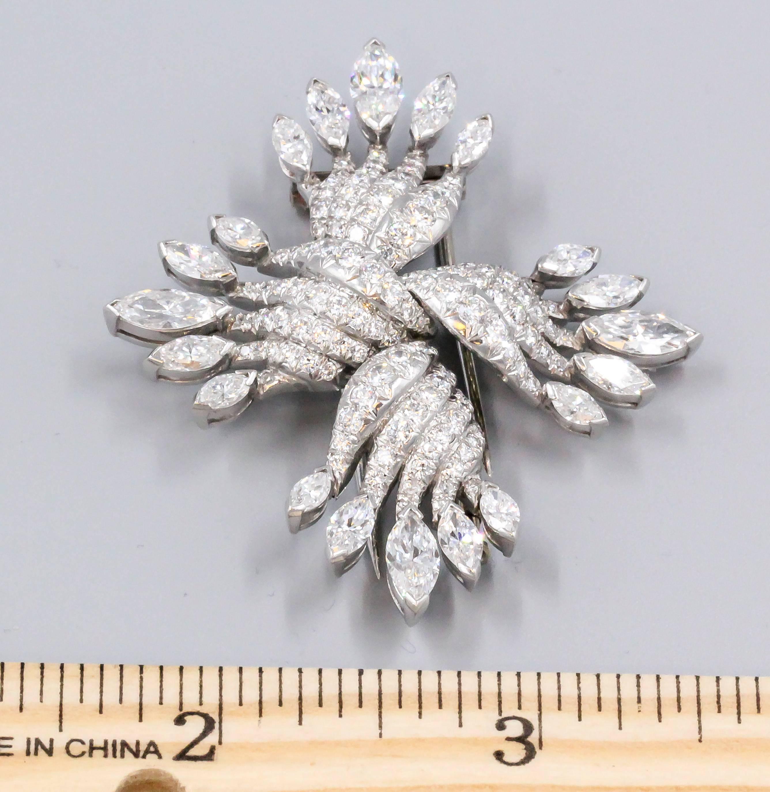 Chic diamond and platinum brooch by Tiffany & Co. Schlumberger. It features very high grade round brilliant cut and marquise cut diamonds, approx. 12.0 carats of total diamond weight. Beautifully crafted with an elegant design that features four