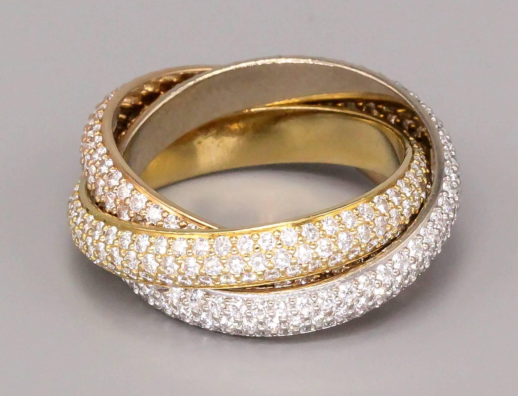 Timeless Diamond and 18K yellow, white and pink gold rolling ring from the 