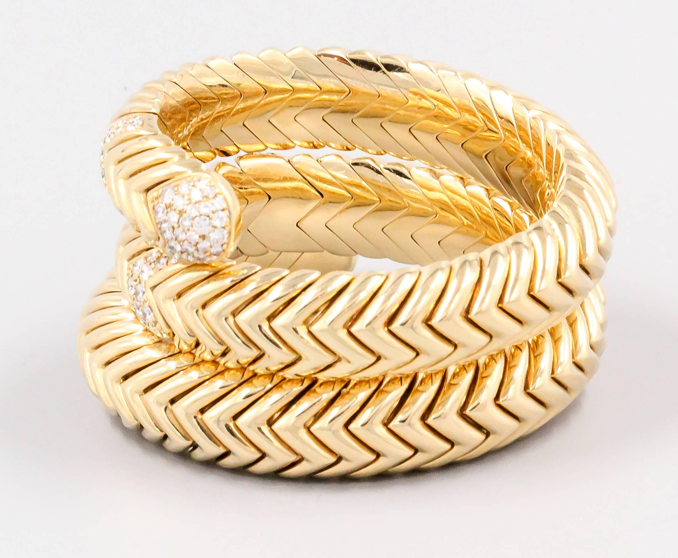 Timeless diamond and 18K yellow gold snake bracelet, from the "Spiga" collection by Bulgari. It features very high grade round brilliant cut diamonds of approx. 4.5 carats. Exquisite workmanship in this bracelet, which also features a