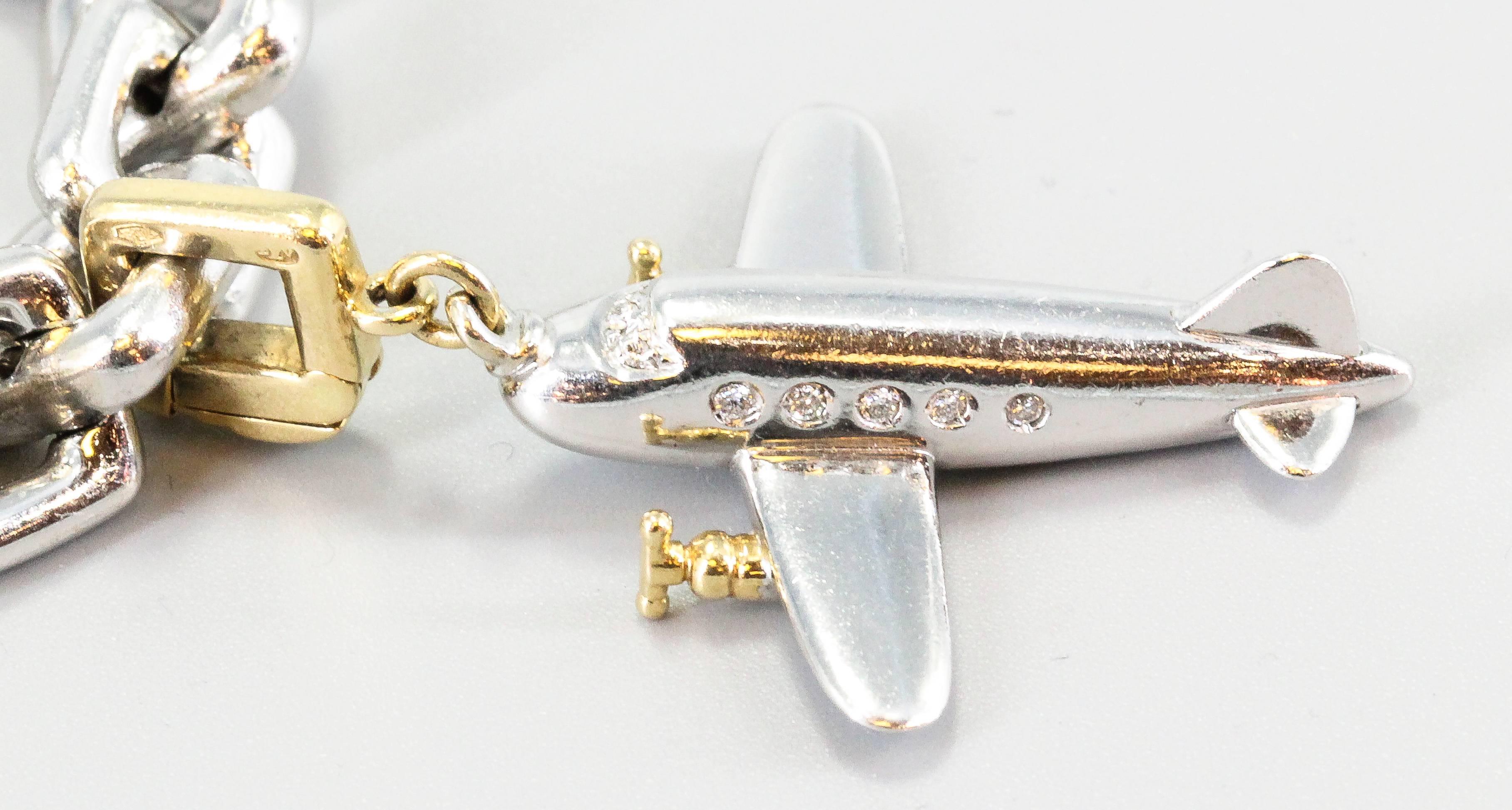 Chic 18K white gold heavy charm bracelet by Louis Vuitton. It features a thick square link design, with 5 distinct charms: a set of keys, a heart with lion crest that reads 